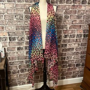 Leopard print, rainbow colored high low vest with tassels